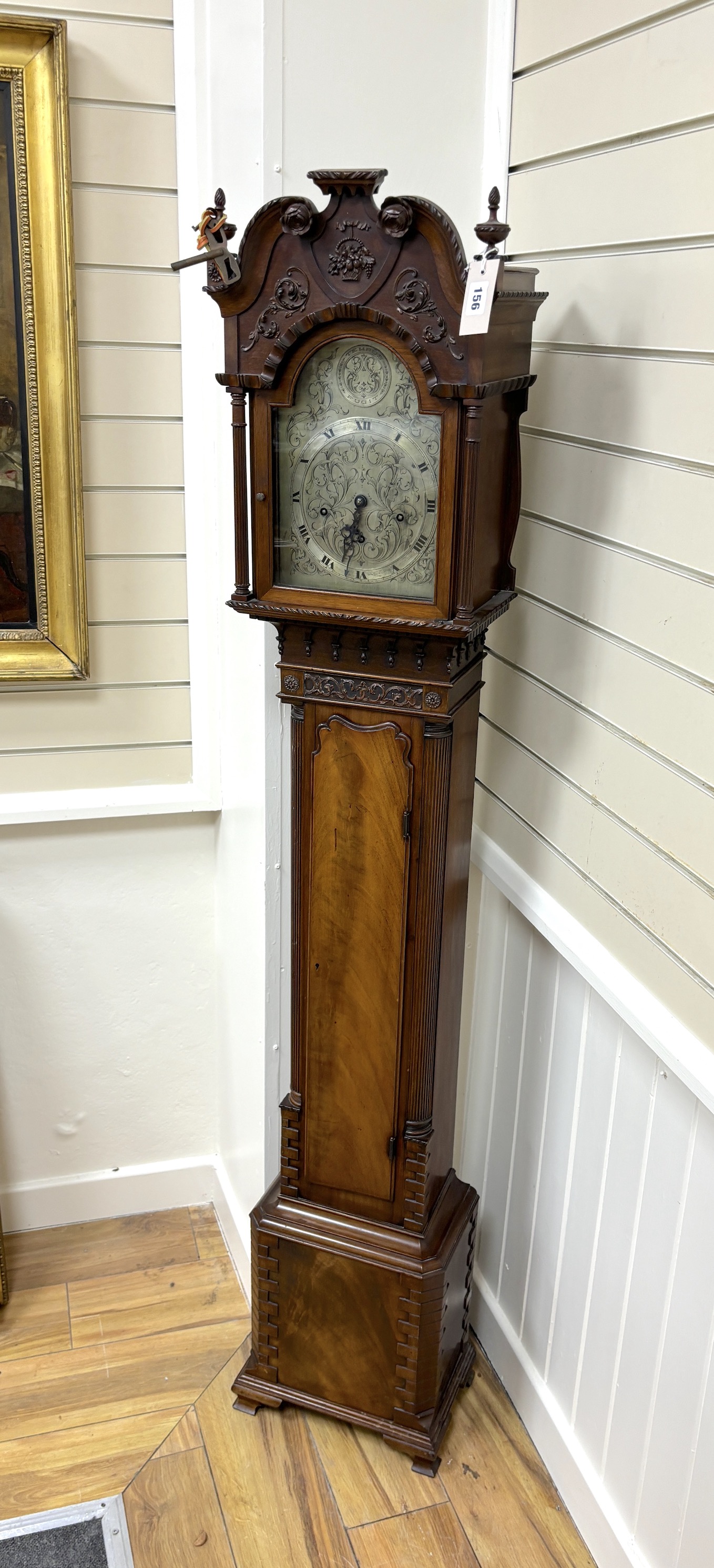 A 1920's George III style mahogany grandmother clock with arched silvered dial and three train movement, height 172cm.